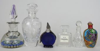 Five glass scent bottles including an English millefiori, Chanel No.19, one with white metal penguin