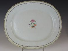 A 19thC Chinese famille rose oval plate with central floral decoration, 33x38cm