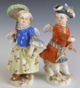Two Meissen putti, each with blue crossed swords mark to base, H9.5cm