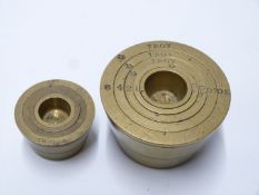 Two runs of Troy ounce nesting cup weights, one 8oz downwards, the other 2oz downwards
