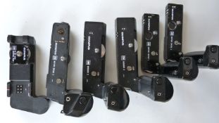 Five Olympus camera winders comprising two motor drive 1, one motor drive 2 amd two winder 2,