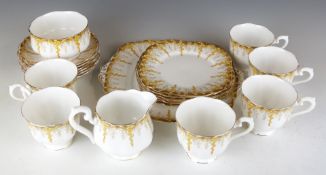 Twenty one pieces of Royal Albert tea ware hand decorated in enamels in the April Showers pattern