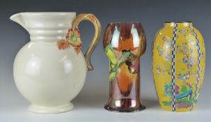 A group of 20thC ceramics including Clarice Cliff jug, Wilkinsons lustre pedestal vase decorated