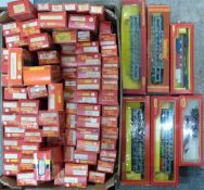 Eighty-two Tri-ang 00 gauge model railway wagons, vans, car transporters, tankers etc, all in