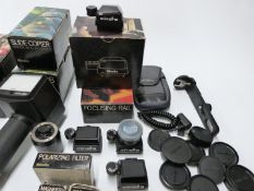 Minolta camera accessories to include flash meter IV with 5 and 10 degree viewfinders, P finder in