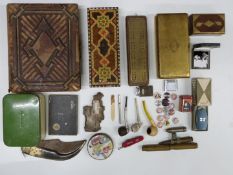 A group of collectables including Huntley and Palmer tin, Swiss Army knife, old shell/bullet