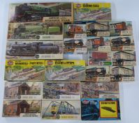 Twenty-four Airfix 00 gauge model railway plastic model kits including wagons, tankers. buildings,