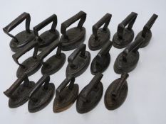 Sixteen miniature or small flat irons, all of oval shape, to include Smith, Kenrick, AK&Son and