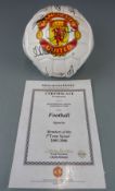 Two Manchester United signed footballs, one signed by members of the 1999 treble winning squad