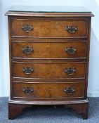 A walnut bow fronted bedside or miniature chest of four drawers, W46 x D34 x H60cm