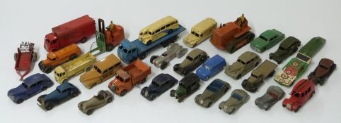 Thirty Dinky Toys diecast model vehicles including Foden Flatbed, military car, Auto Union racing