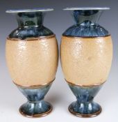 A pair of Doulton Lambeth pedestal vases, H20cm