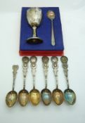 Five Chinese white metal tea spoons and a Chinese white egg cup and spoon set