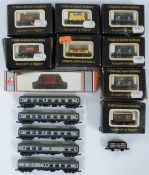 Graham Farish N gauge model railway rolling stock comprising five BR blue coaches, nine goods wagons