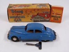 Tri-ang No.2 Minic Musical Car with blue body, silver hubs bumpers and grille, in original box