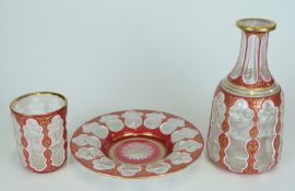 Overlaid cut glass decanter, up and underplate with cranberry and white overlaid on a clear ground