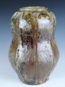 Mike Dodd (b 1943) studio pottery cut sided ash glazed gourd shaped vase, H25cm