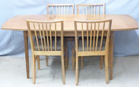 A Vanson retro table and four chairs, W132 x D89 x H74cm, extended 182cm