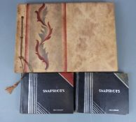 Victorian photograph album containing portraits of men, women and children, several with pets, a