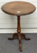 19thC fruitwood circular side table with turned tapering support, raised on a moulded triform