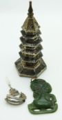 Chinese white metal model of a pagoda, a Chinese charm depicting a junk and a nephrite jade Maori