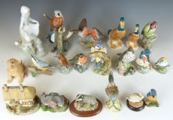 A large collection of ceramic figures including Lladro, Mack China birds, Beswick Ducks etc