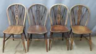 Two pairs of elm seated Windsor dining chairs