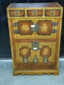 Oriental cabinet with three drawers and two cupboards, raised on a shaped apron W61 x D34 x H82 cm