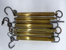 Seven cylindrical Salter spring balances comprising 28, 50, 60, two 80lb, 40kgs and 3kgs examples