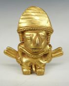 Colombian gilt metal figure with suspension loops verso, H5.5cm