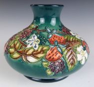 Moorcroft squat pedestal vase with tube lined flower decoration, H11cm
