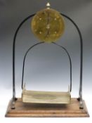 Salter No 85 spring balance, on arched support and with brass pan, to weigh 56lb, height 85cm