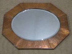 A copper framed Arts and Crafts style octagonal mirror, W67cm