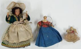 Two 19thC doll's house dolls comprising a small bisque lady and child both with painted hair and