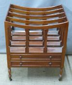 A mahogany Canterbury / magazine rack with two drawers raised on castors, W47 x H58 x D36cm