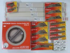 A collection of Fleischmann 00 gauge model railway track, points and a turntable, all in original
