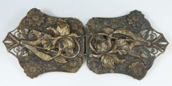 Art Nouveau gilt metal belt buckle decorated with lilies, width 11.5cm