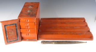 A vintage Mah Jong set and an Eastern letter opener