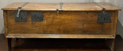 An 18thC elm coffer with wrought iron hinges, W142cm x D60 x H56cm
