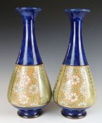 A pair of Royal Doulton vases impressed 8884 and HJ, H28cm