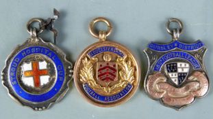 9ct gold and hallmarked silver football fobs including Gloucestershire Football Association Northern