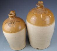 Two flagons, James Tate & Sons Wells and S Hunt & Son, Burford, height of taller 38cm