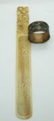 A c1900 Chinese ivory letter opener depicting two women and a Chinese cloisonné napkin ring
