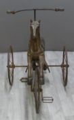 Victorian cast iron and carved wooden tricycle carved in the form of a prancing horse, 82cm long.