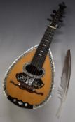Unlabelled late 19thC 31 piece fluted and silvered bowl back six string Lombardi mandolin, the