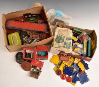 A collection of Meccano and Dinky Builder parts including wheels, rods etc, some in original boxes.