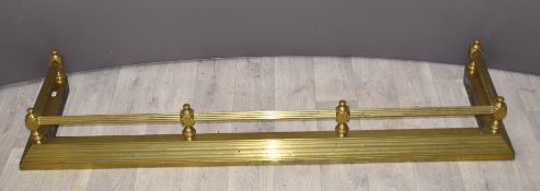 A brass fire fender, W136cm
