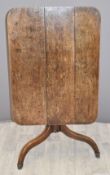 19thC oak tilt top table raised on a tripod base and stepped feet, W88 x D65 x H69cm