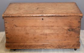 19thC pine trunk with twin drop handles on castors, W86 x D48 x H46cm