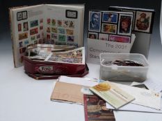 USA 2001 Commemorative Stamp Yearbook, two boxes of all-world stamps, covers etc, and a Strand stamp
